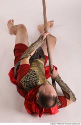 MARCUS LAYING POSE WITH SPEAR